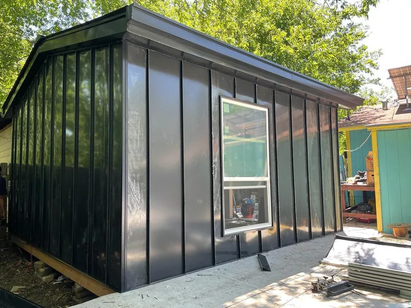 Black standing seam metal wall panels for Roof Inspection in Columbia Falls