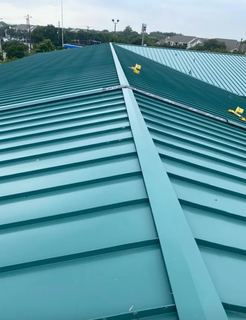 Green commercial metal roof ridge and valley for Metal Roof Repair in Columbia Falls